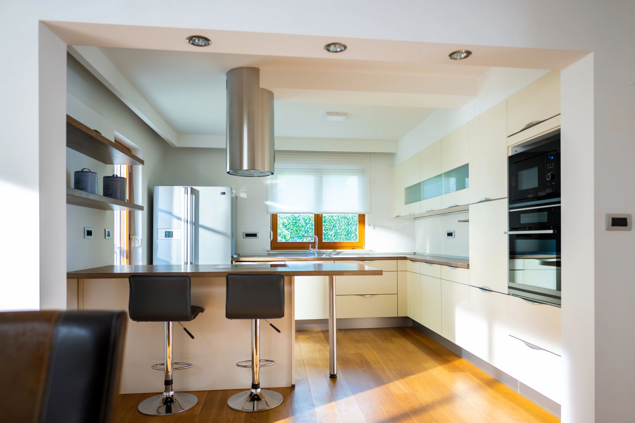 Sunlit kitchen with upscale interior finishes