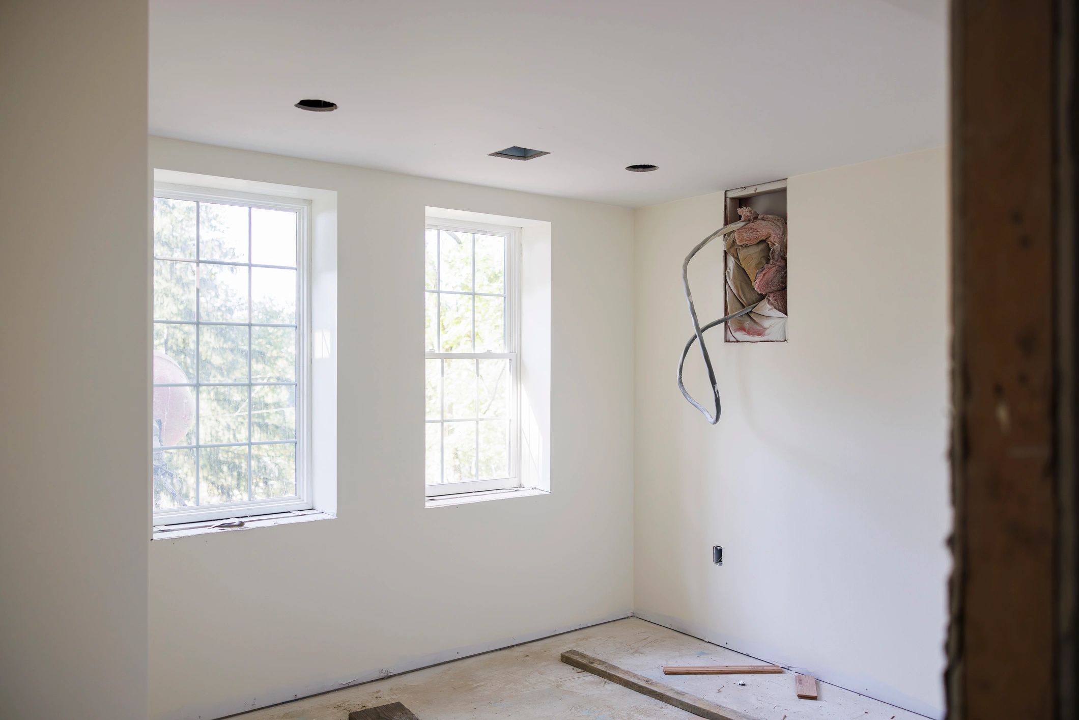 Interior remodeling project with bright windows and freshly finished walls